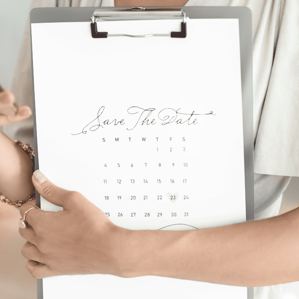 Woman holding save the date clipboard